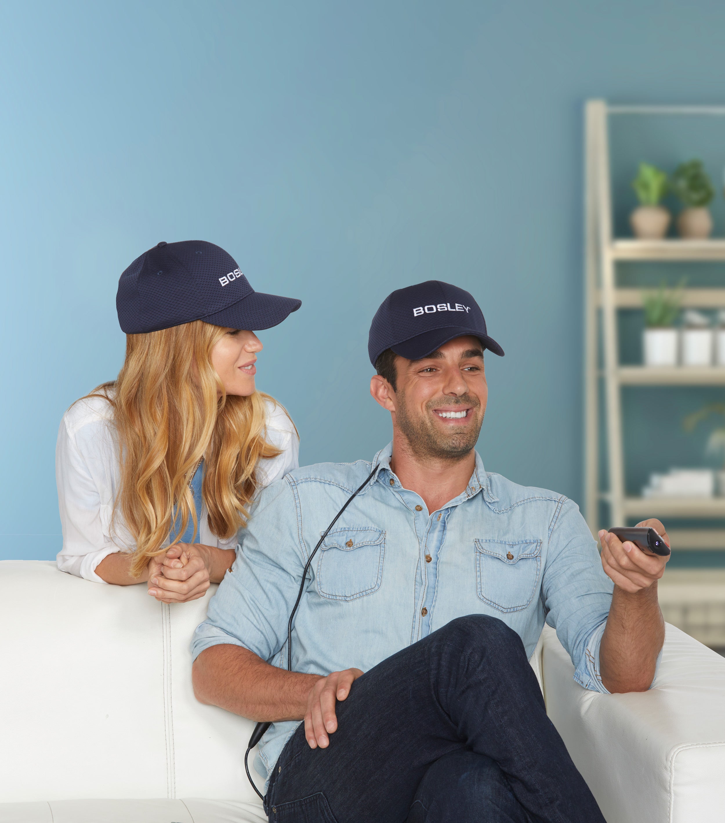 Bosley Revitalizer Cap Man and Woman Wearing Caps on Couch