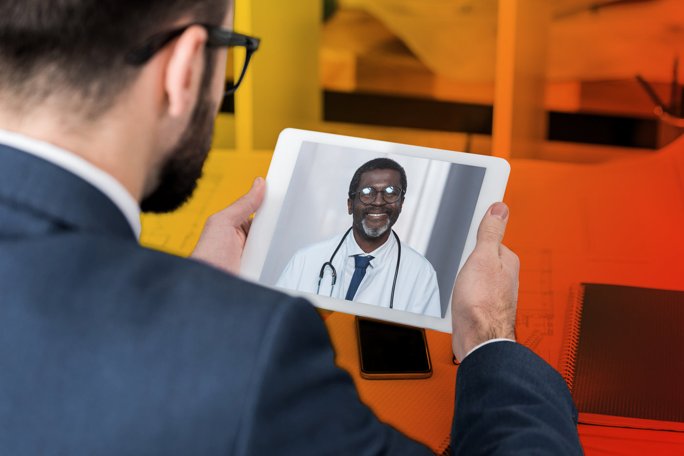 Bosley Doctor Video Visit - Man With Tablet in Hands